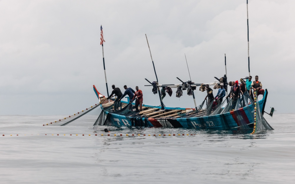 Fishers in Liberia hauling in nets