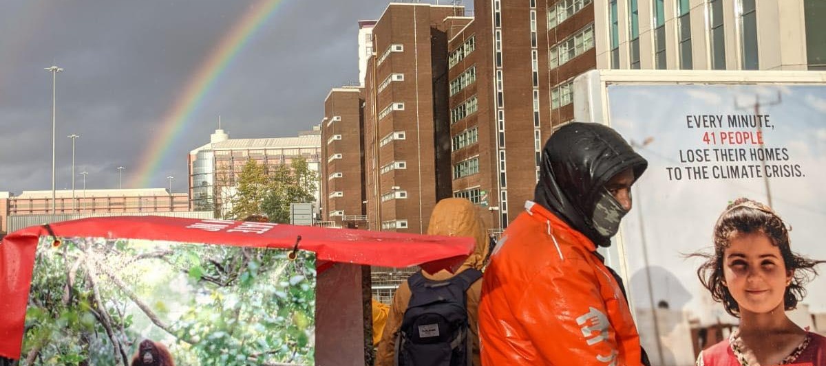 EJF rickshaw and rainbow at climate protests at COP26