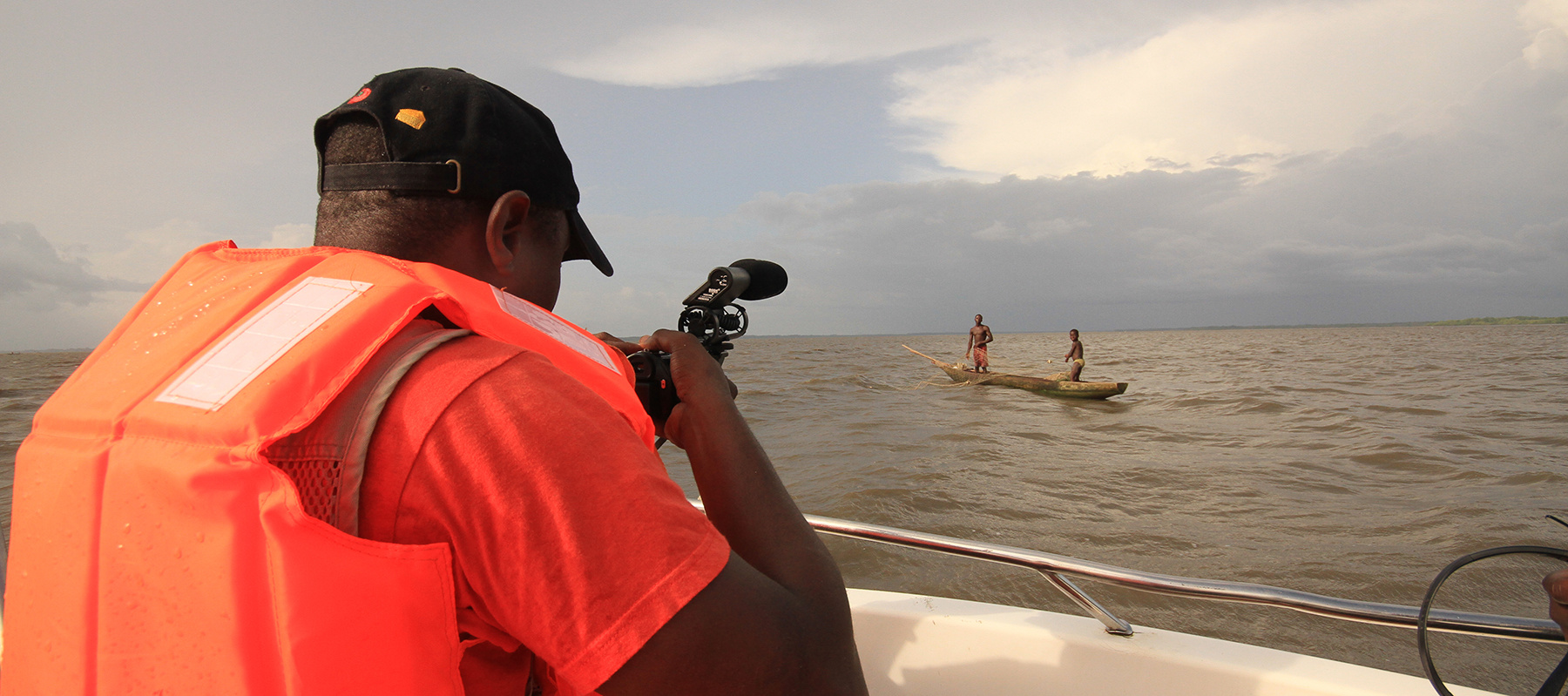 Guy Filming Boat