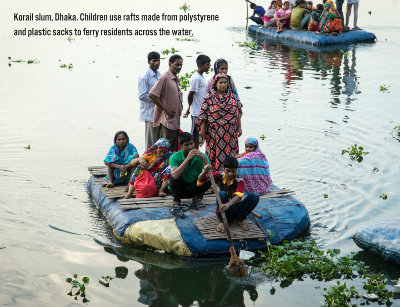 Korail Slum Dhaka  Children Use Rafts Made From Polystyrene And Plastic Sacks To Ferry Residents Across The Water
