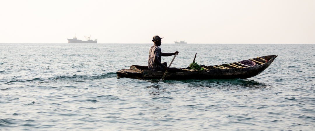 Man on a fishing canoe